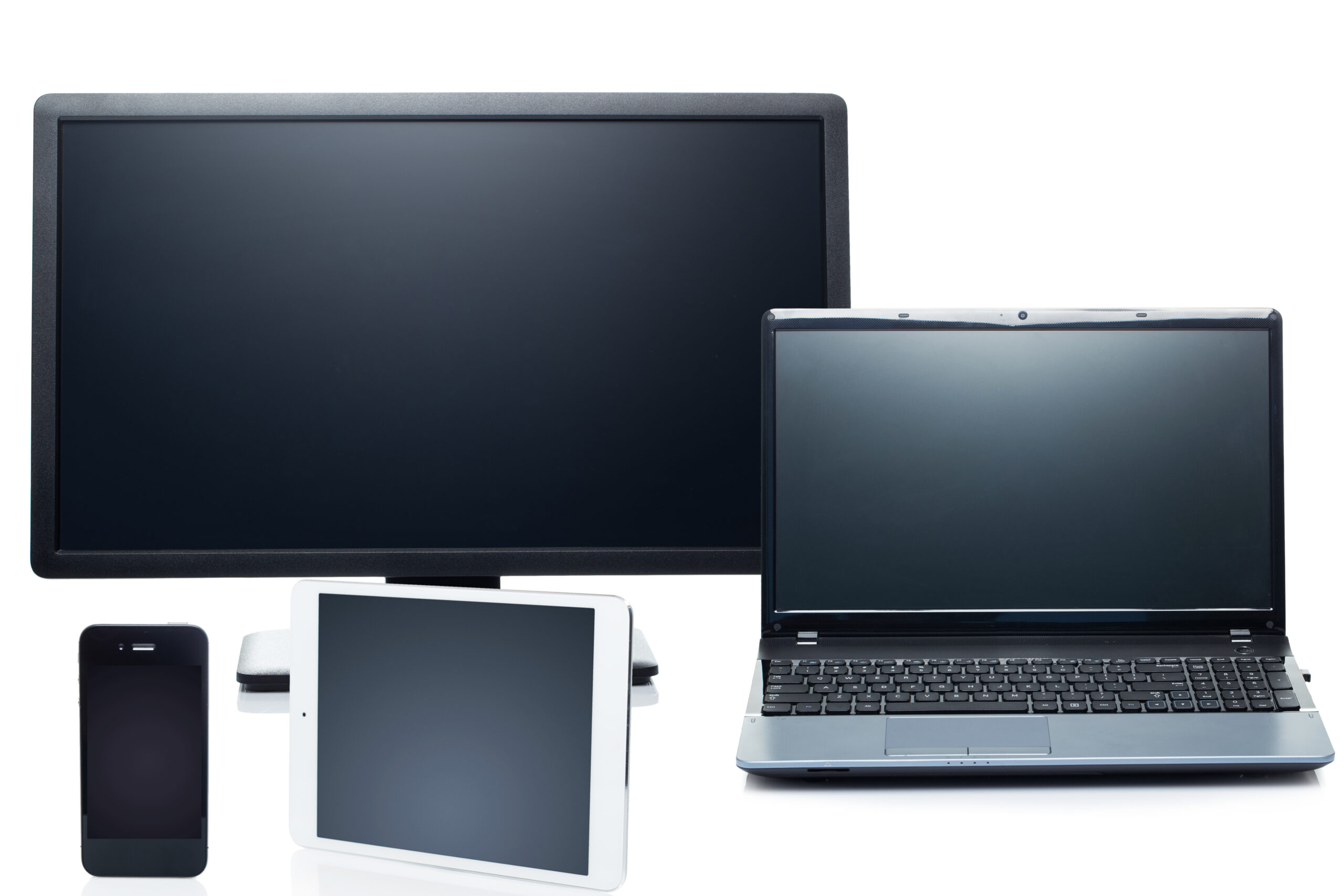 Technology. Laptop, tablet, smartphone and monitor on a white background